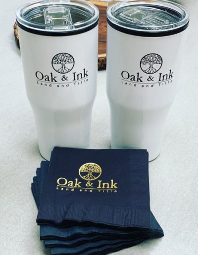 Oak & Ink Land and Title in Punta Gorda, FL branded cups and napkins